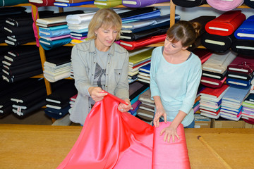 designer inspecting a textile