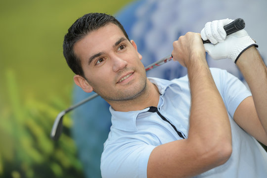 close up portrait of man on golf course