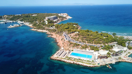 Aerial drone bird's eye photo of famous marina of Vouliagmeni with luxury yachts docked in south Athens riviera Peninsula with turquoise clear waters, Greece