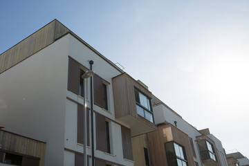 Modern apartment buildings on a sunny day with a blue sky