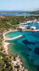 Selbstklebende Fototapeten Aerial drone bird's eye photo of famous marina of Vouliagmeni with luxury yachts docked in south Athens riviera Peninsula with turquoise clear waters, Greece © aerial-drone
