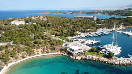 Naklejka premium Aerial drone bird's eye photo of famous marina of Vouliagmeni with luxury yachts docked in south Athens riviera Peninsula with turquoise clear waters, Greece