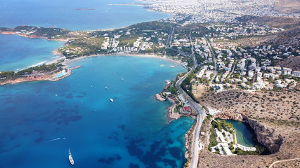 Aerial drone, bird's eye photo from iconic lake Vouliagmeni famous for healing abilities and Ateras...