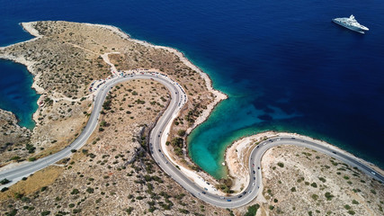 Aerial drone bird's eye view photo of road in Athens riviera seaside known limanakia forming small...