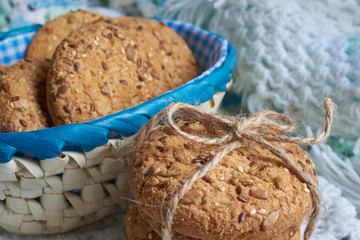 Savory cookies sprinkled with sesame seeds, sunflower on textile plaid