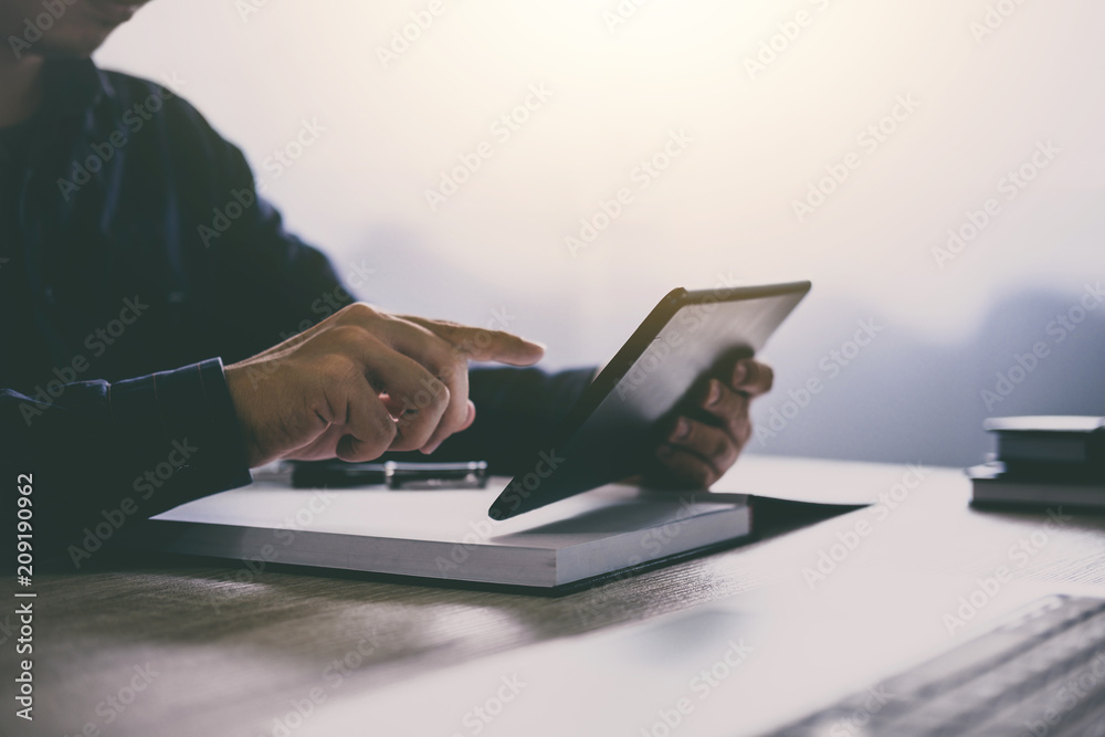 Poster professional at work, businessman using tablet working analysis investment connection at modern work