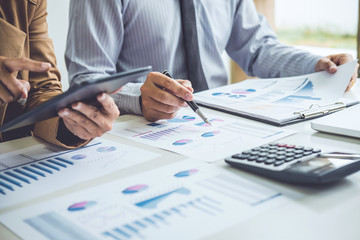 Business people conference and discussing the charts and graphs showing the results of their successful teamwork, business concept