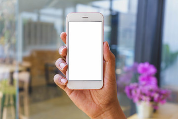 Man's hands holding smartphone with blank white screen can be add your texts or others, empty copy space for advertising, product display.