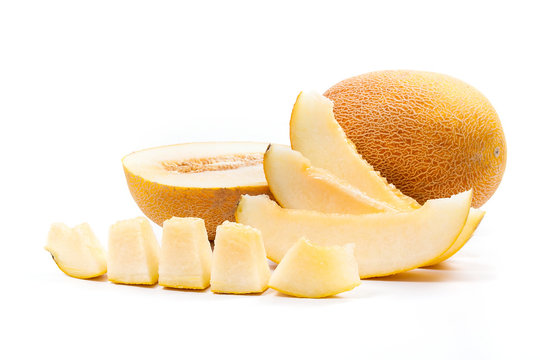 Whole, half and sliced honeydew melon tropical fruit isolated on a white background.