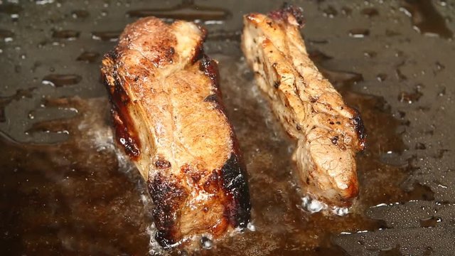 Frying pork ribs in pan