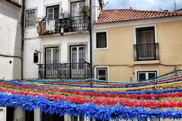 Streets adorned with garlands in Alfama, Lisbon © SoniaBonet