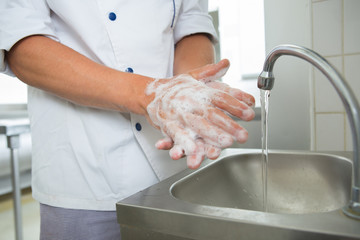 chef washing hands - obrazy, fototapety, plakaty