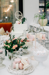 Macaroons and cake pops on a sweets table at a wedding