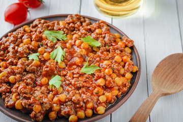 Chili con carne with pork and chickpeas. Mexican or Texas traditional food