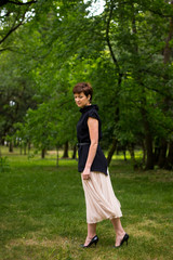 Portrait of beautiful aged woman in the park