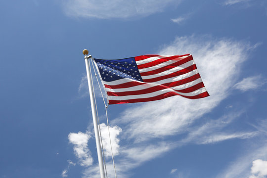 USA. Arizona. US flag floating in the sky.
