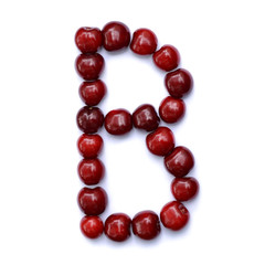 Letter B made with cherries to form a letter of the alphabet. Berry letters on a white background.