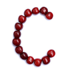 Letter C made with cherries to form a letter of the alphabet. Berry letters on a white background.