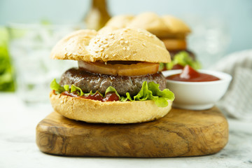 Beef burgers with tomato and lettuce