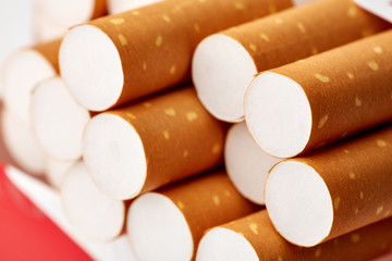 cigarettes in a pack close-up on a white background. Drug addiction. Smoking of tobacco. cancer. Nicotine. Bad habit.