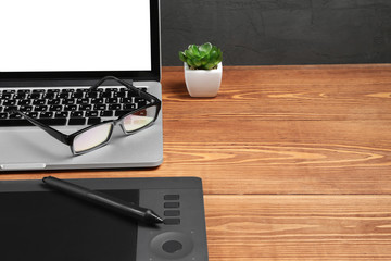 laptop and graphic tablet on the table