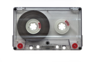 An old blank transparent audio cassette, isolated on white background (Objects, Technology).