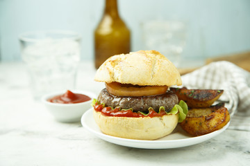 Beef burger with red onion, tomato, cucumber and fried