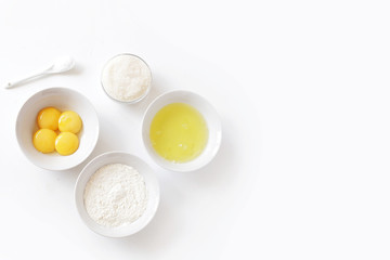 Ingredients for baking - eggs, flour, salt, sugar top view
