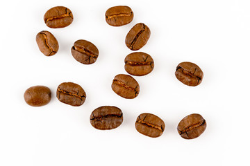 close up of medium or dark roasted coffee beans isolated on white background, can be used as a background or graphic object in your ads.