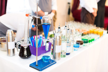 Blue Curacao in a chemical test tube. Set of test tubes and various chemical devices for preparations of molecular cocktails.