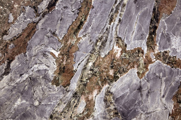 Colorful layered marble texture with different veins, may be used as background