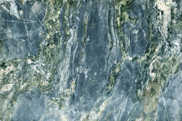 Colorful layered marble texture with different veins, may be used as background
