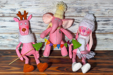 Soft pink toys - a fun elephant, a hare and a deer.