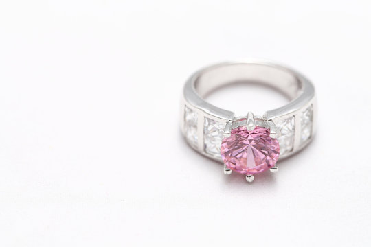 pink gem stone on diamond ring