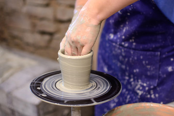 Fototapeta na wymiar Team work (and training) in pottery