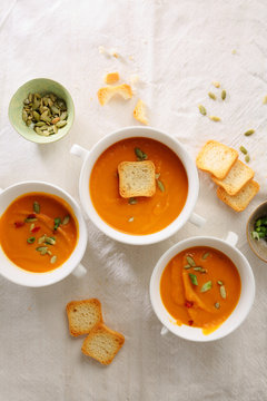 hot pumpkin cream soup and croutons