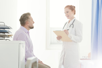 Fototapeta premium General practitioner talking with patient