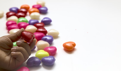 Valentines Day Concept: child holding heart .candy feast