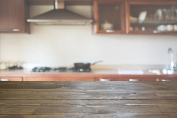 Blurred background. Modern kitchen with tabletop and space for you.