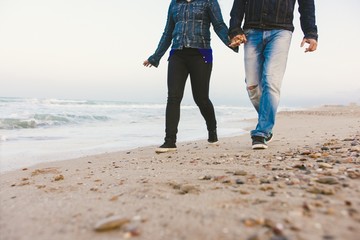 Couple of lovers with green sneakers and standing jeans