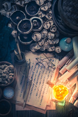 Top view of old scrolls and recipe in laboratory