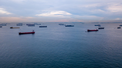 Aerial view of container ships in the Singapore Strait at dusk