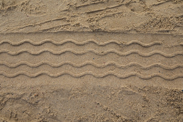 Driving on a sandy beach: tracks left behind