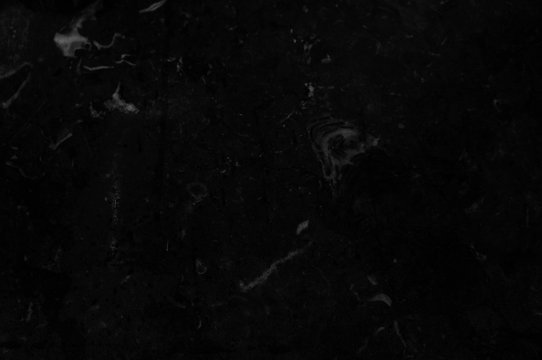 Black marble texture with light veins and spots. Perfect natural pattern for background or tile       