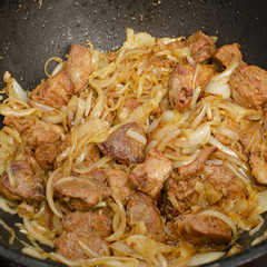 Meat cooking in cauldron