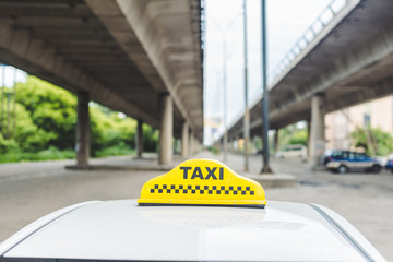 close-up view of yellow taxi sign on top of cab