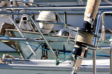 Detail of a roller-furling jib of a sailboat moored in the harbor