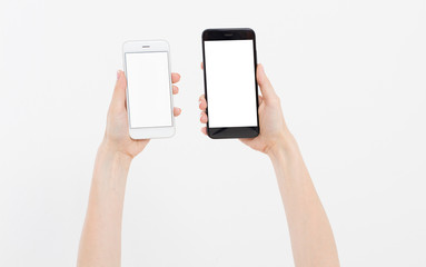 Obraz na płótnie Canvas Hand holding white and black phones isolated on white clipping path inside. Top view.Mock up.Copy space.Template.Blank.