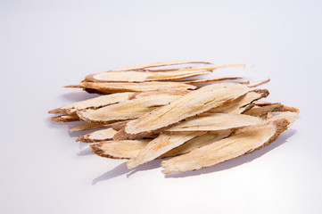 Chinese herbal medicines -- Astragalus on white background, blank for text copy space,