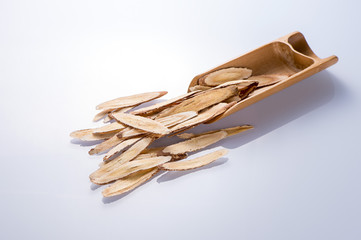 Chinese herbal medicines -- Astragalus on white background, blank for text copy space,